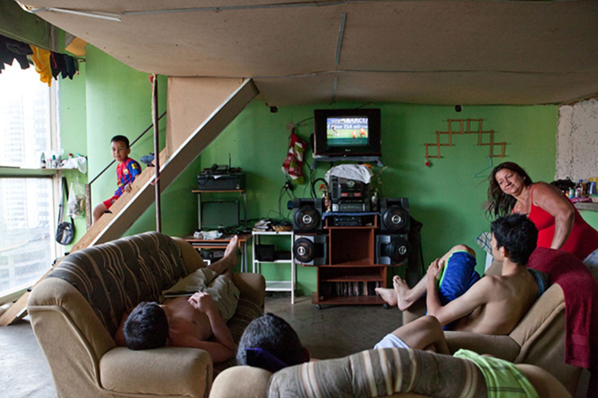 A family relaxes in a living room.