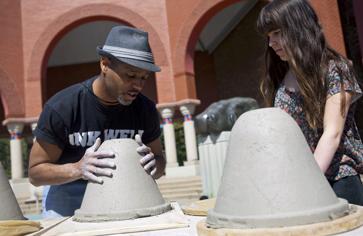 B. Stephen Carpenter II gives a demonstration to a student at Penn State. Credit: Steven Rubin.