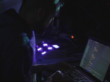 Jason Levine livecoding at an Algorave. Photo: Courtesy of the artist.