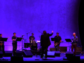 Glenn Branca Ensemble performs Ascension III, featuring Reg Bloor, Arad Evans, Eric Hubel, Luke Schwartz, guitar, Greg McMullen, bass, Owen Weaver, drums, Glenn Branca, conductor