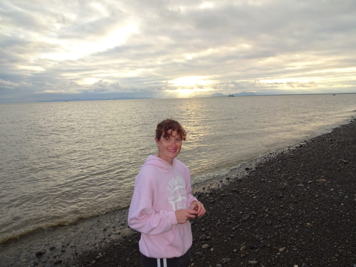 Woman standing by water